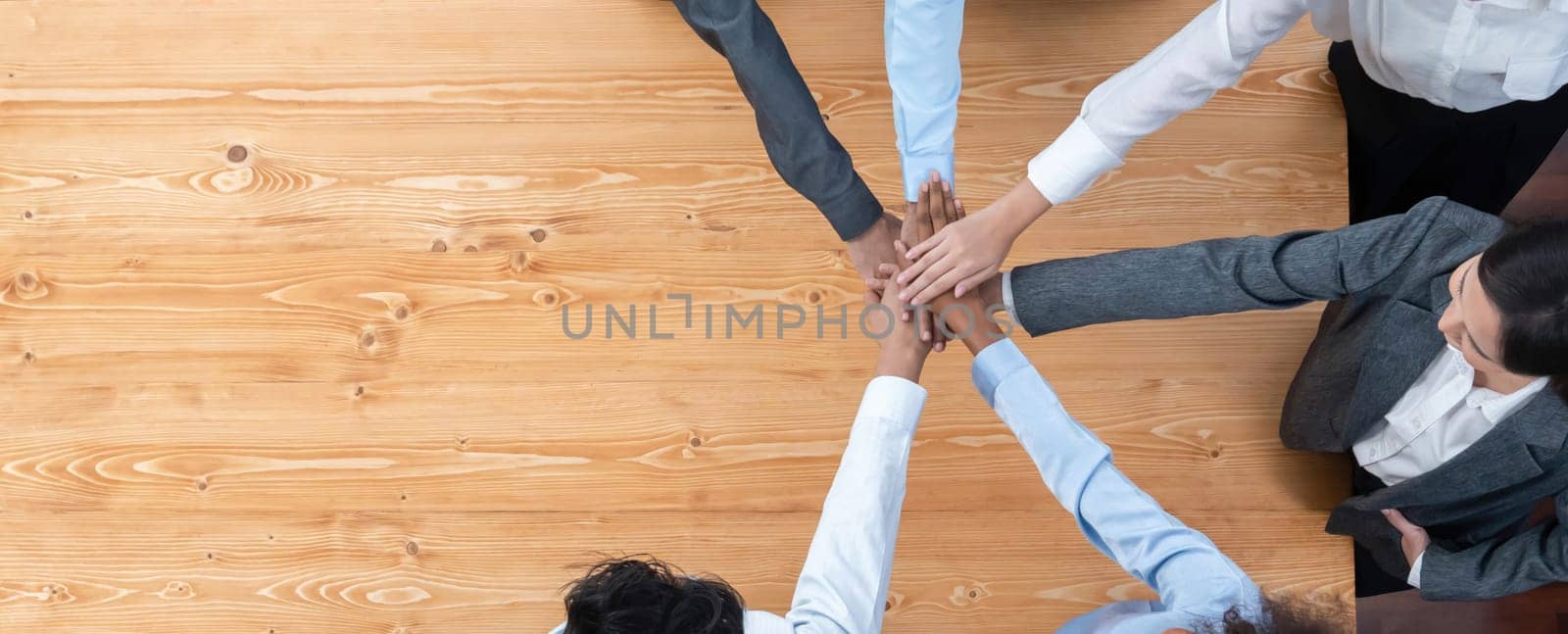 Top view panoramic banner hand stack by office worker show solidarity teamwork and trust in workplace. Diverse businesspeople unite for success with synergy and collaboration by hand stacking. Concord