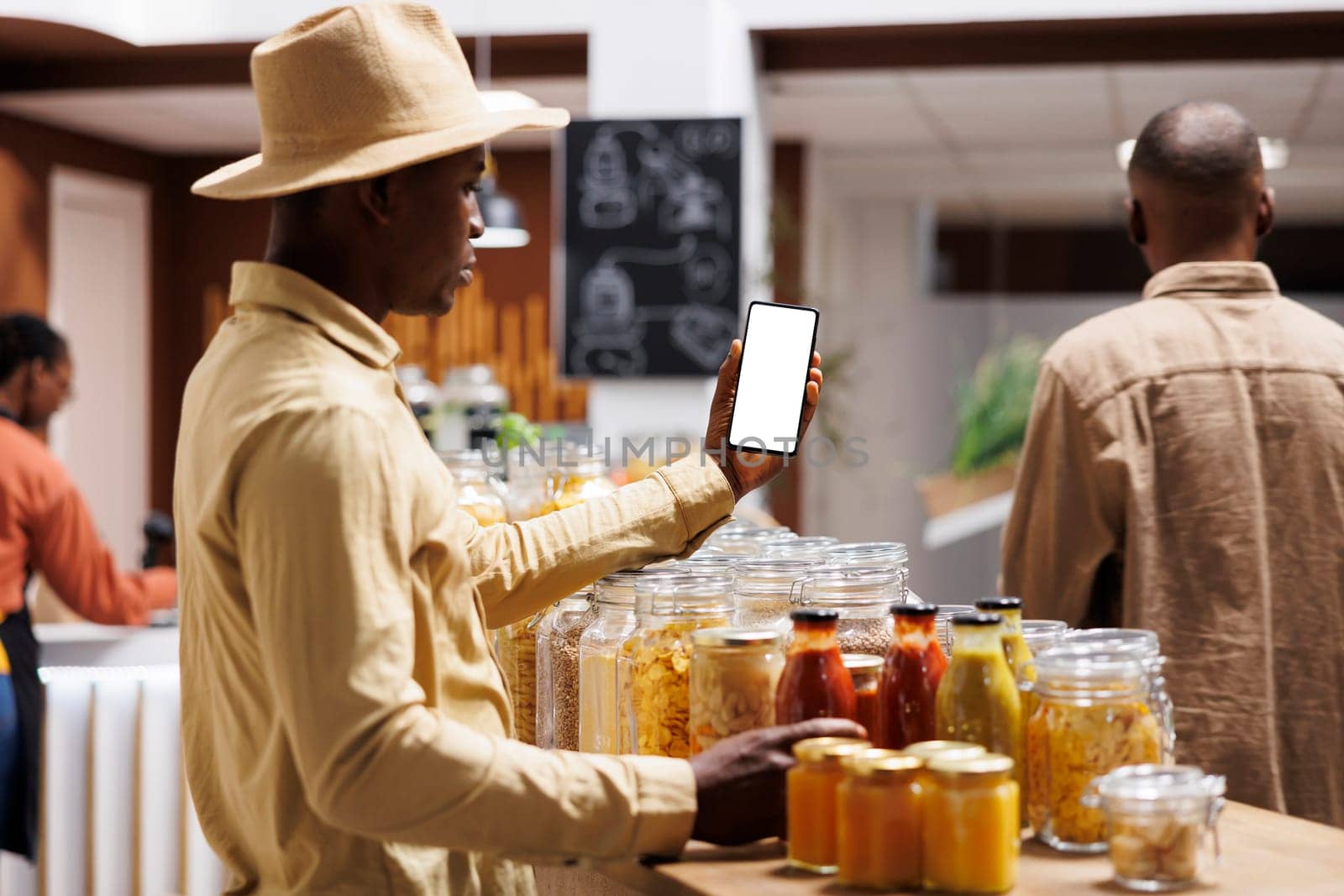 Customer holds phone with white screen by DCStudio