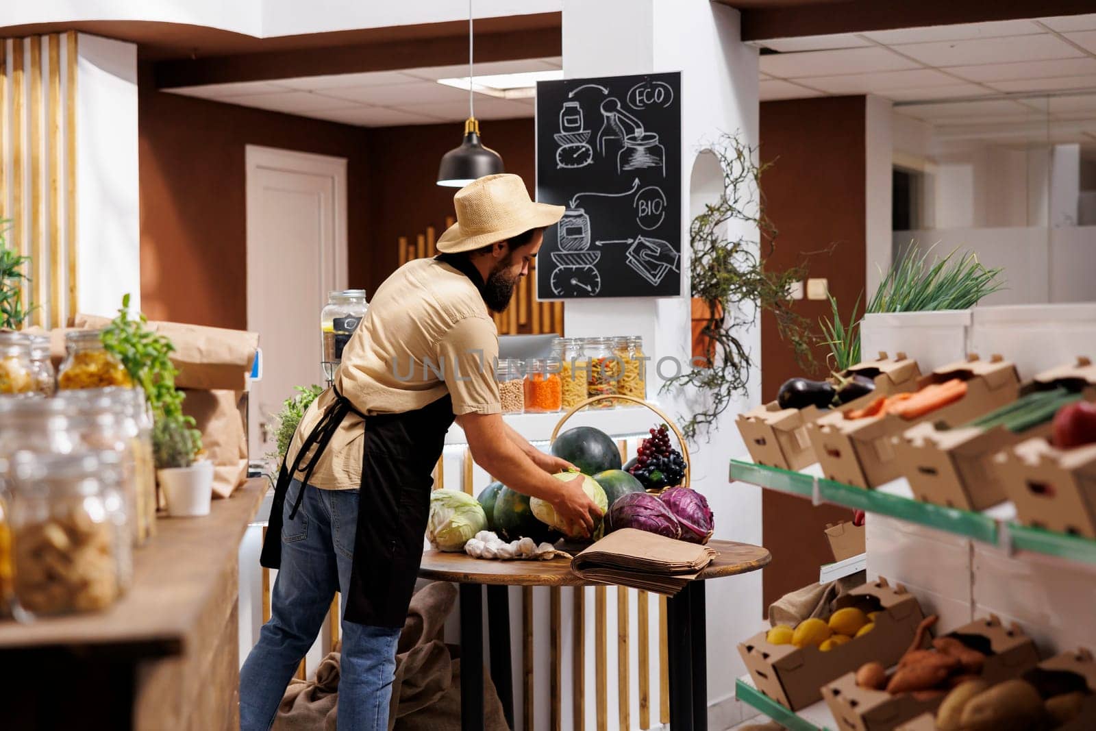 Man sells groceries in zero waste shop by DCStudio