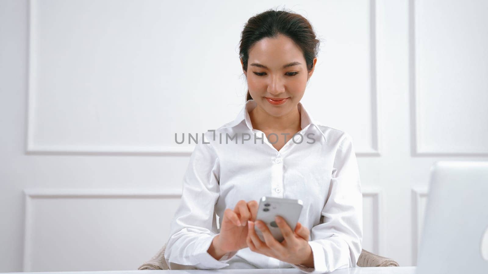 Young woman using vivancy smartphone with for online shopping E commerce. by biancoblue
