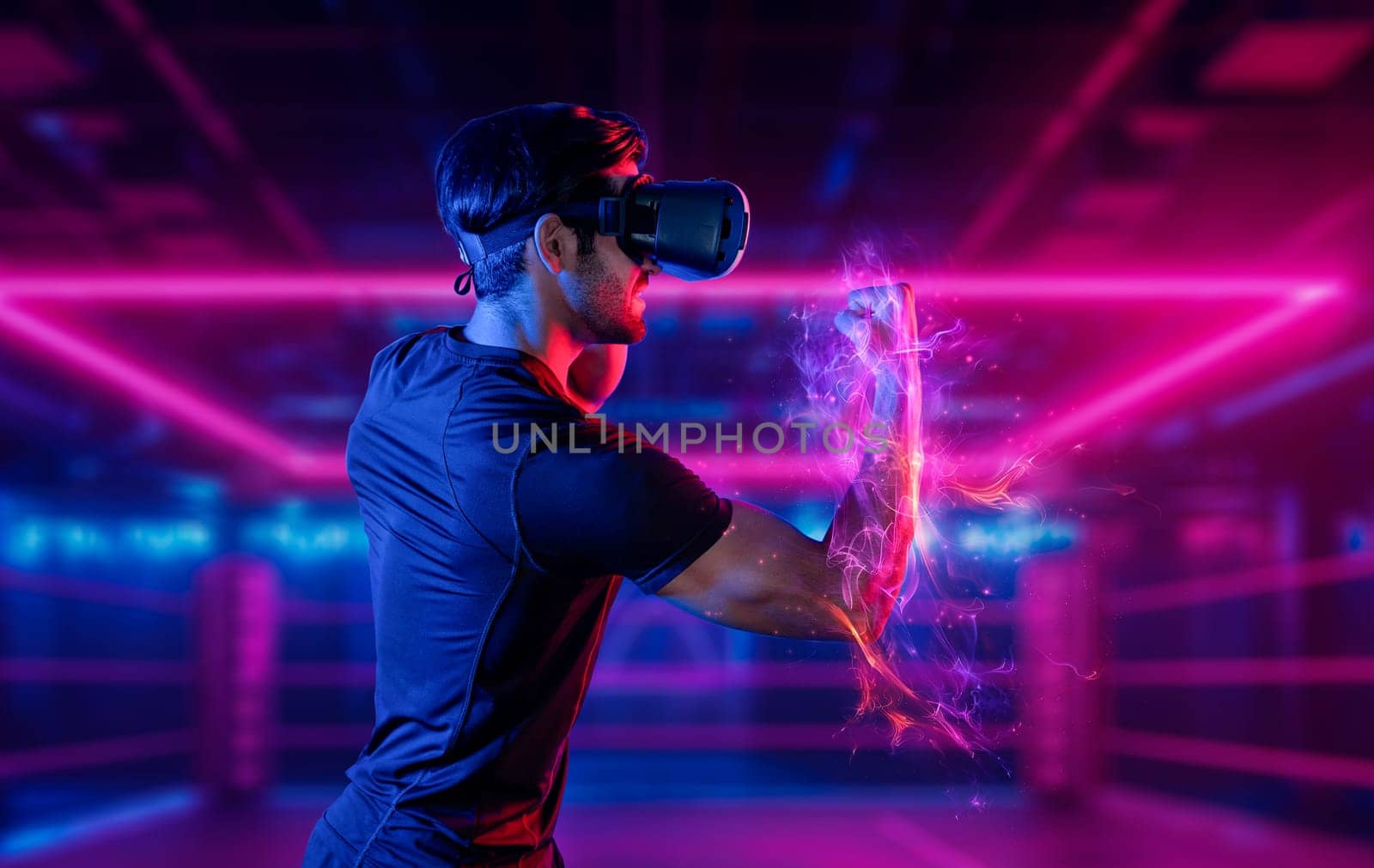 Man wearing VR glass and smashing or punching at camera in neon boxing arena. Sport gamer boxing and moving gesture in metaverse or virtual world while using digital technology innovation. Deviation.