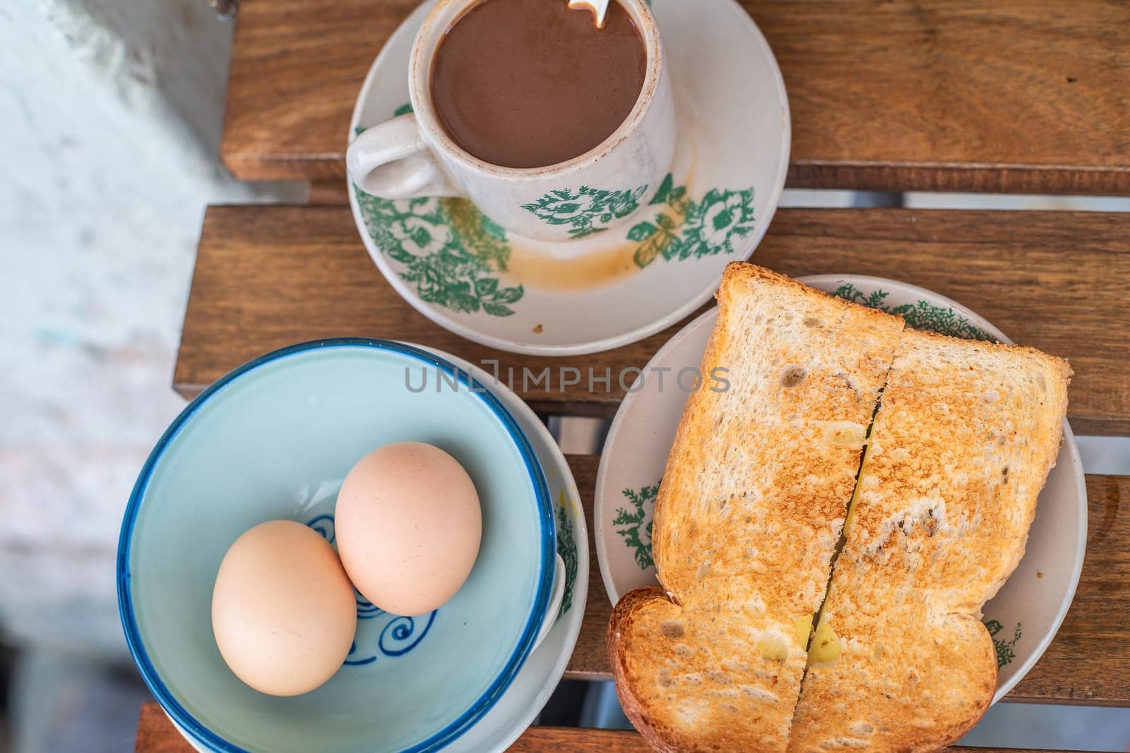 Traditional oriental Chinese kopitiam style in Melaca Malysia eggs bread and coffee 