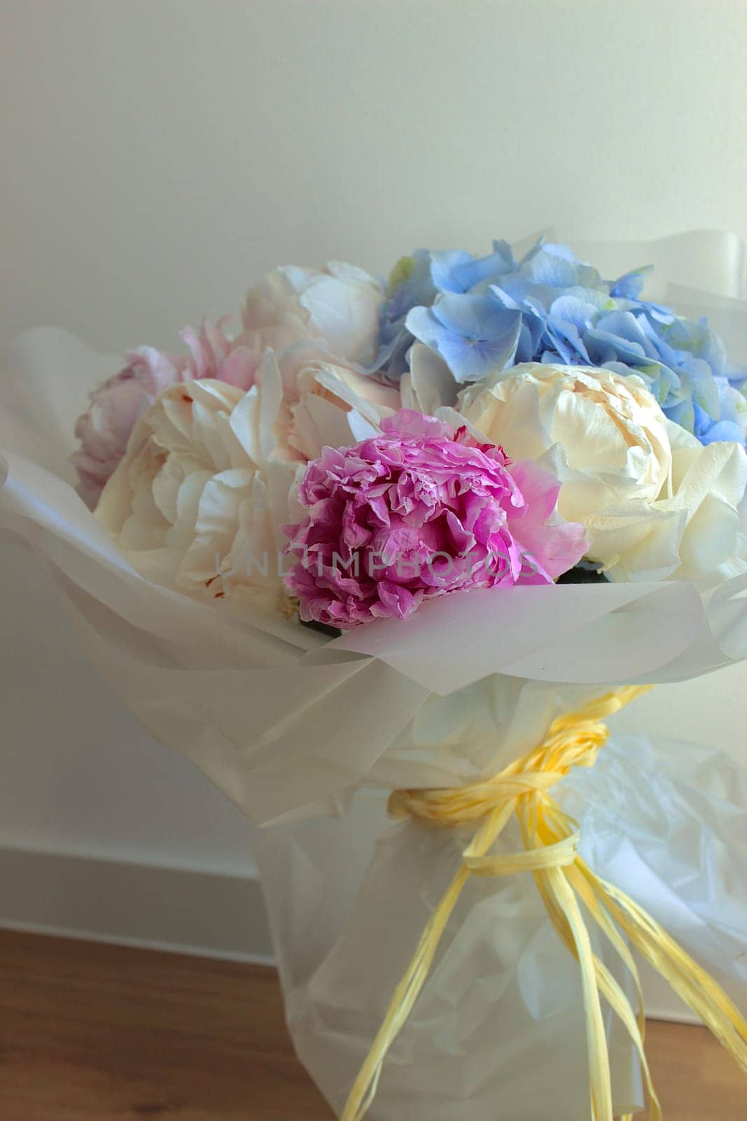 A bouquet of blooming white and pink peonies of delicate color. High quality photo