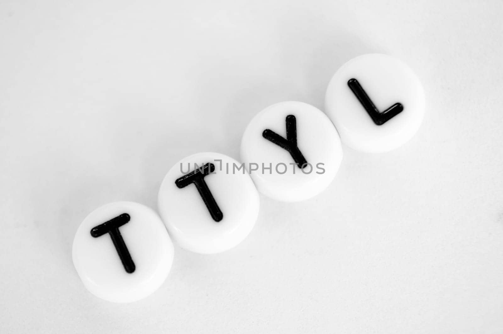 TTYL representing talk to you later text on white background.