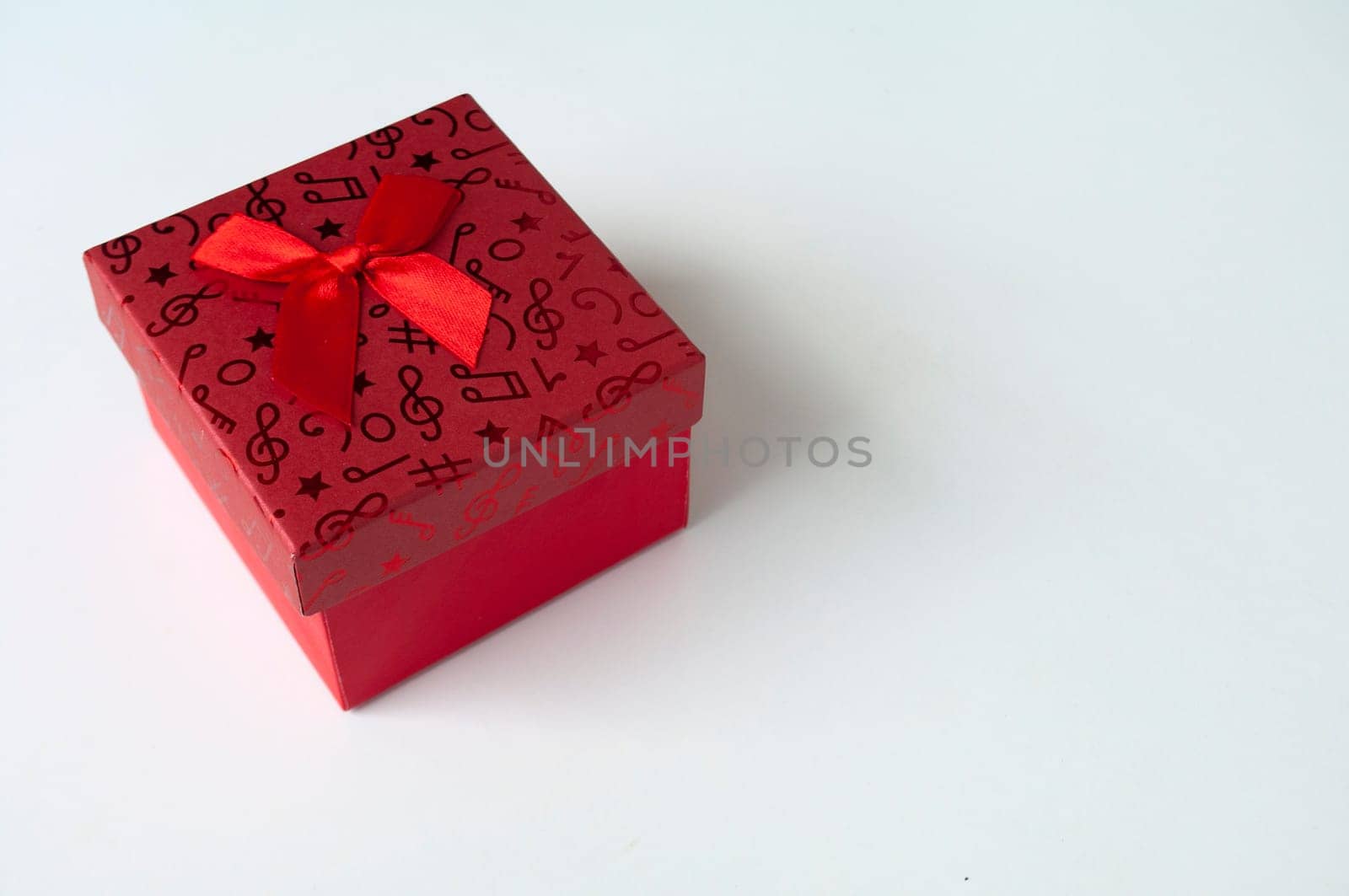 Red color present on white background with customizable space for text. Copy space and celebration.