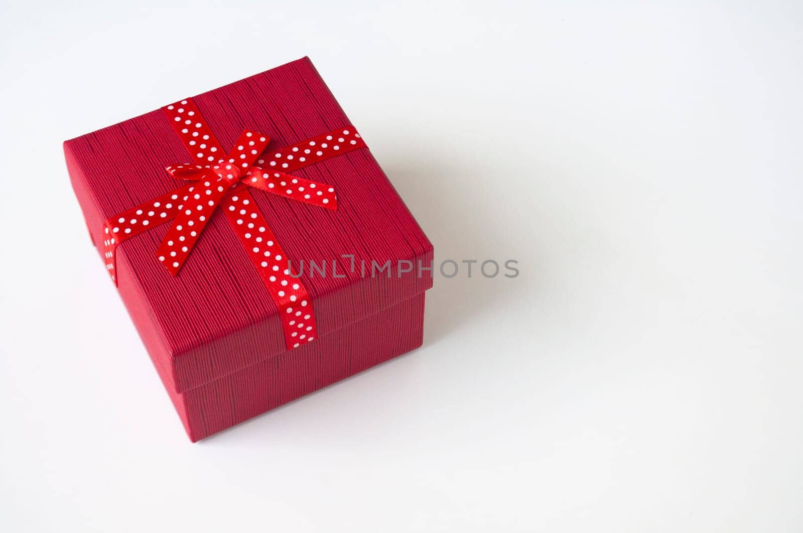 Top view of red color present on white background with customizable space for text.