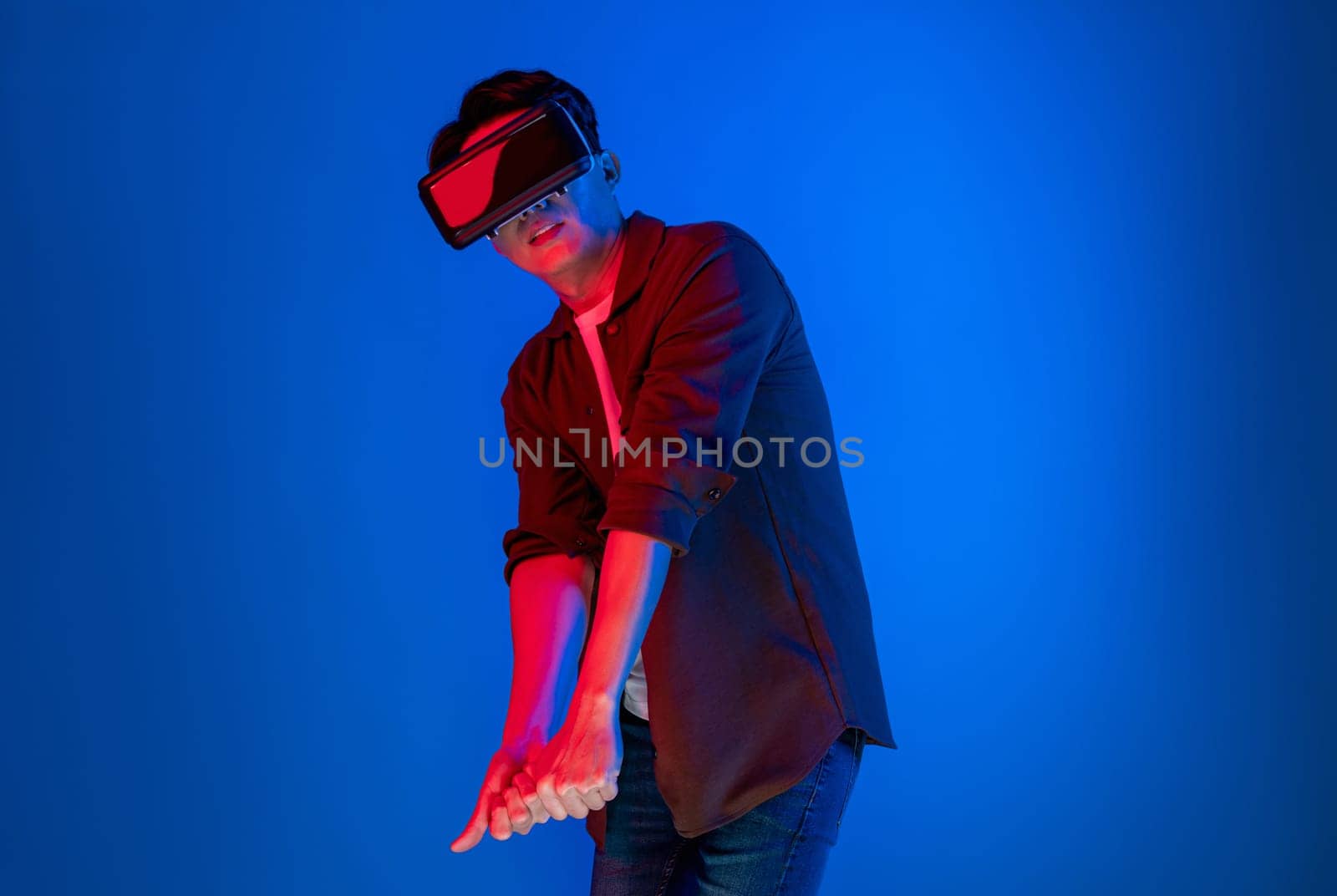 Smart gaming player wearing VR glasses playing golf distance course hologram isolated neon light blue screen connecting digital futuristic technology virtual reality in metaverse world. Contrivance.
