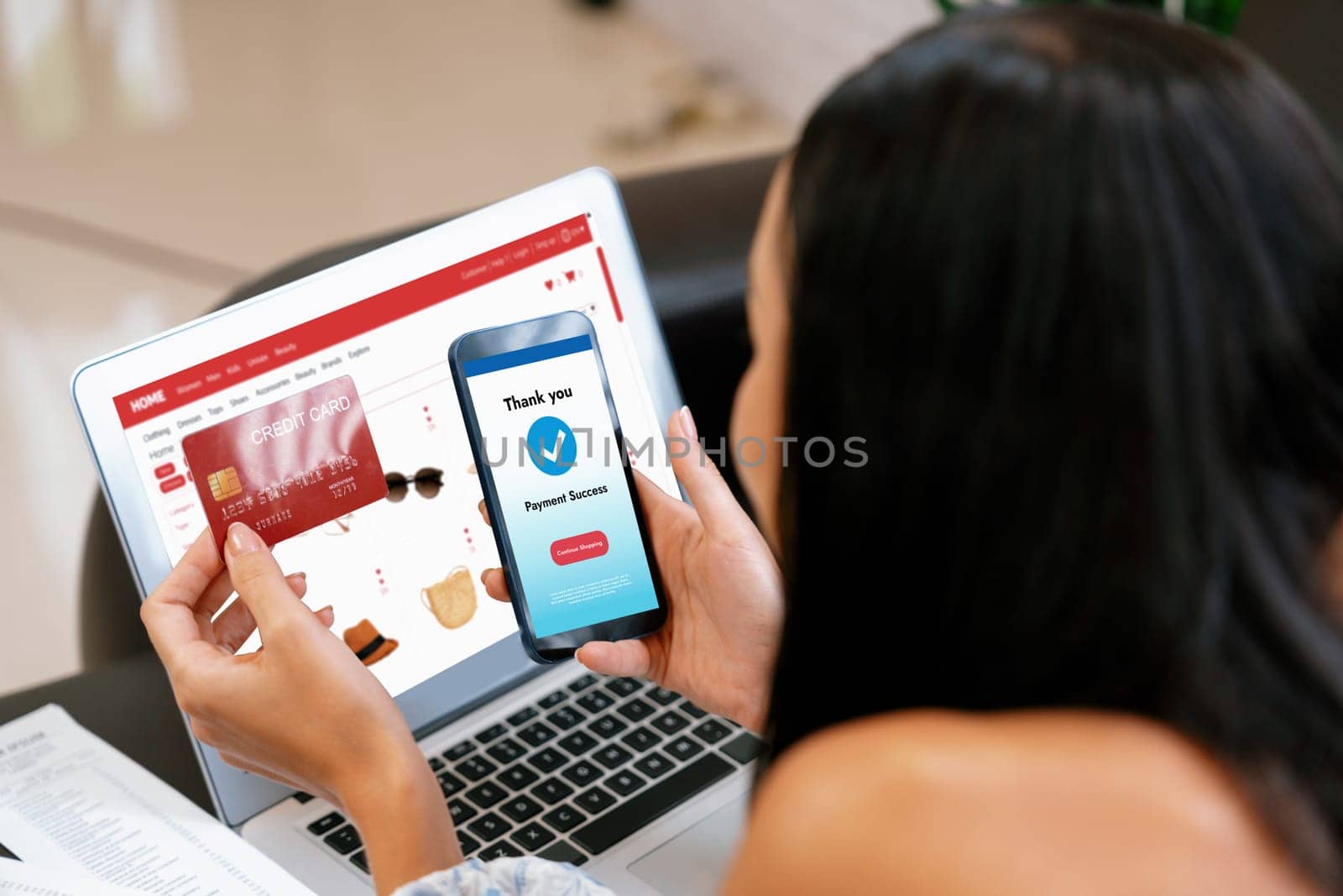 Young woman order or purchase product on internet using laptop and make transaction payment by smartphone. Online shopping lifestyle with credit card via internet banking on mobile application. Blithe