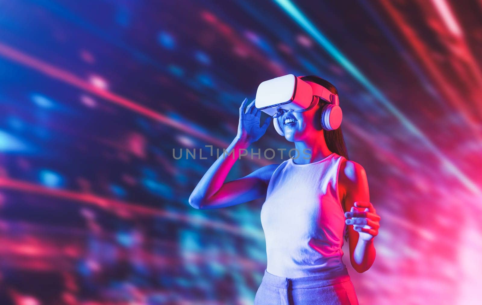 Smart female standing in cyberpunk style building in meta wear VR headset connecting metaverse, future cyberspace community technology, Elegant woman look far position of virtual world. Hallucination.