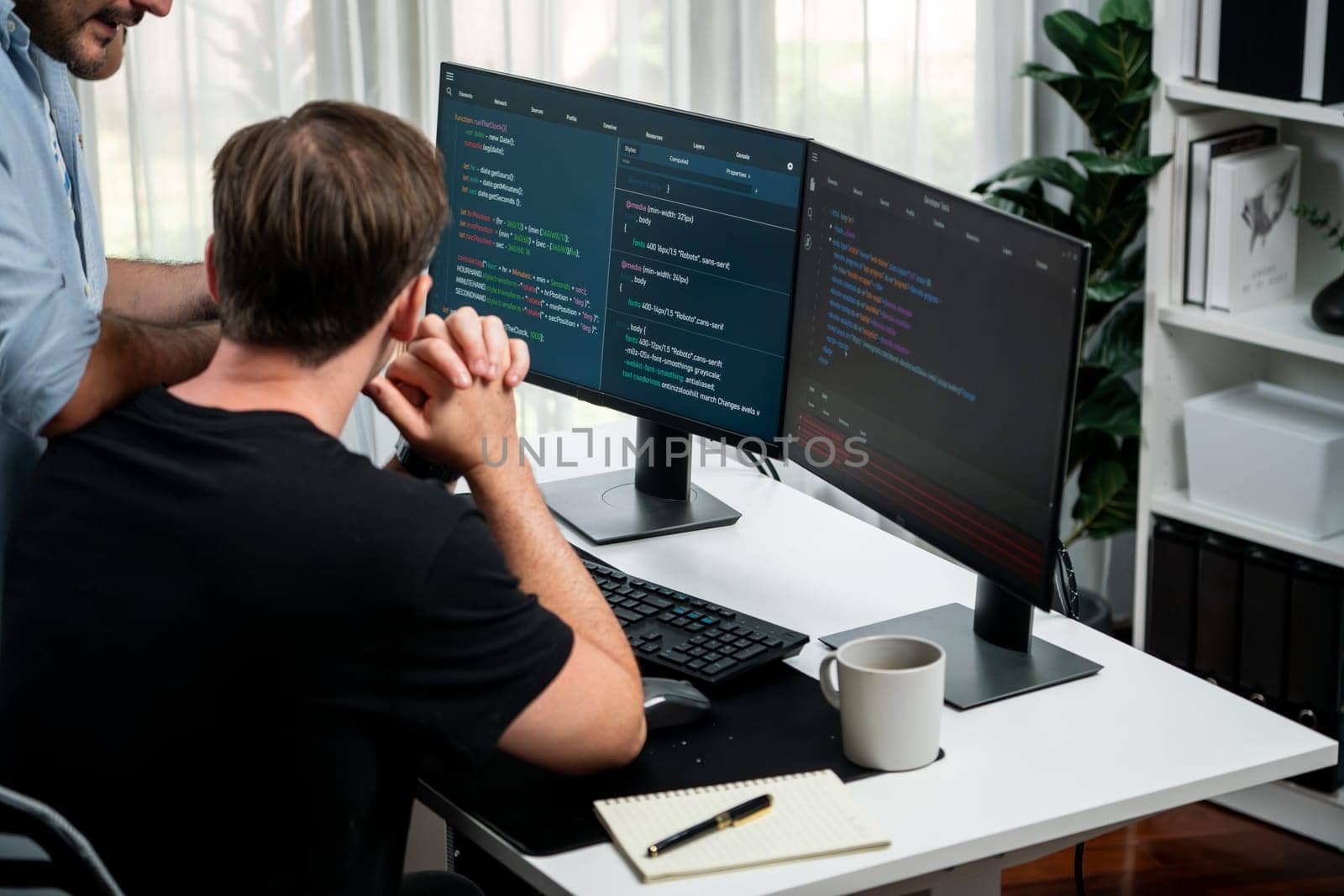 IT developers discussing online software development information on pc screen, creating program coding for latest version application on website. Concept of brainstorming firmware updated. Sellable.