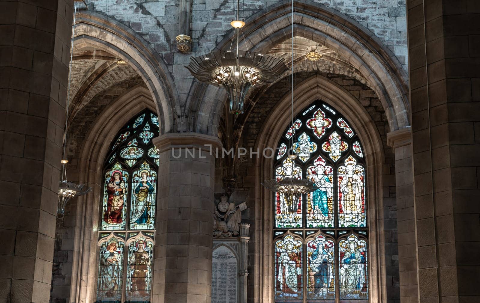 Edinburgh, Scotland - Jan 18, 2024 - Beautiful Chandelier and Glass stained window inside of The thistle chapel in St Giles' Cathedral or the High Kirk. The most important place of worship in the Edinburgh, Space for text, Selective focus.