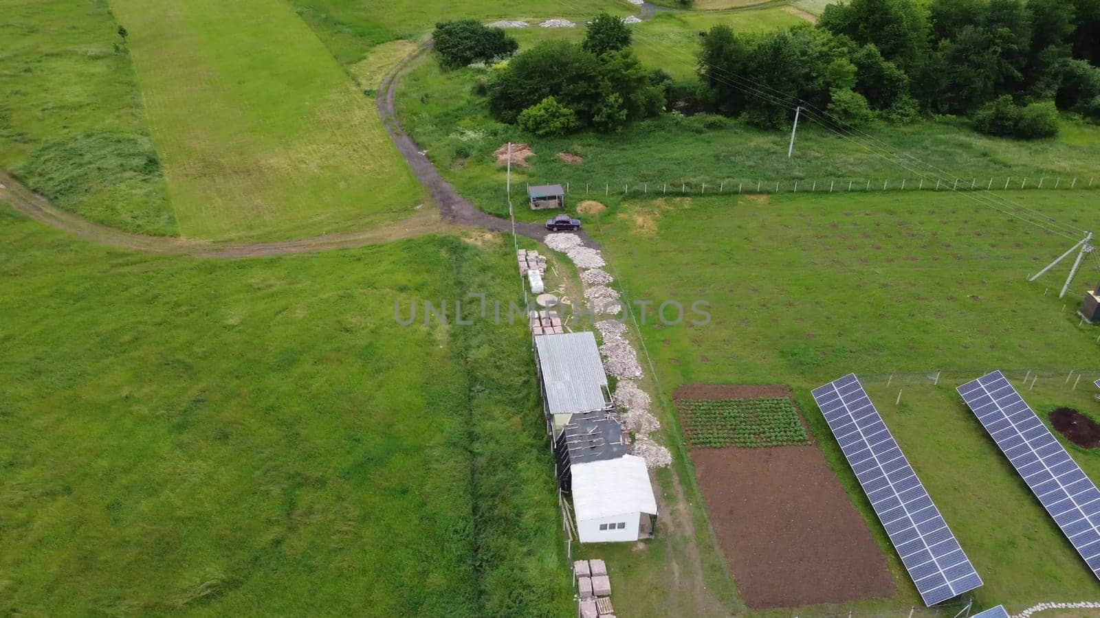 Aerial view of Solar Panels Farm solar cell with sunlight. Drone flight over solar panels field, renewable green alternative energy concept