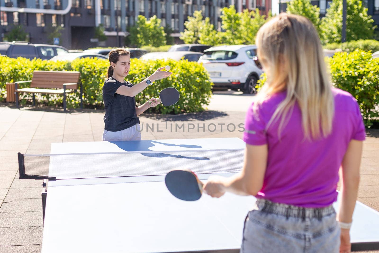 table tennis. mother and daughter play ping pong. High quality photo