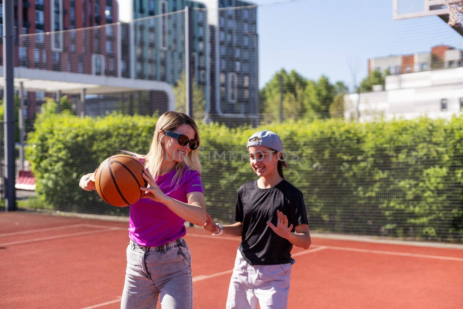 mother and daughter play basketball. High quality