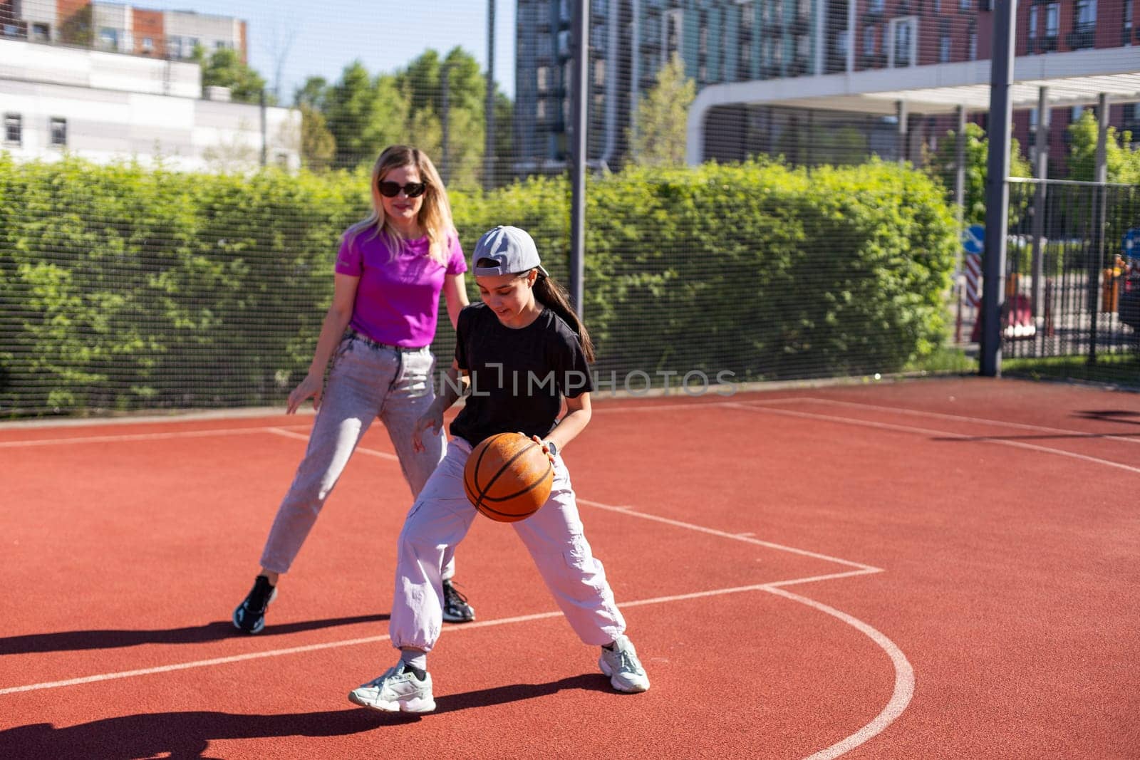 mother and daughter play basketball. High quality