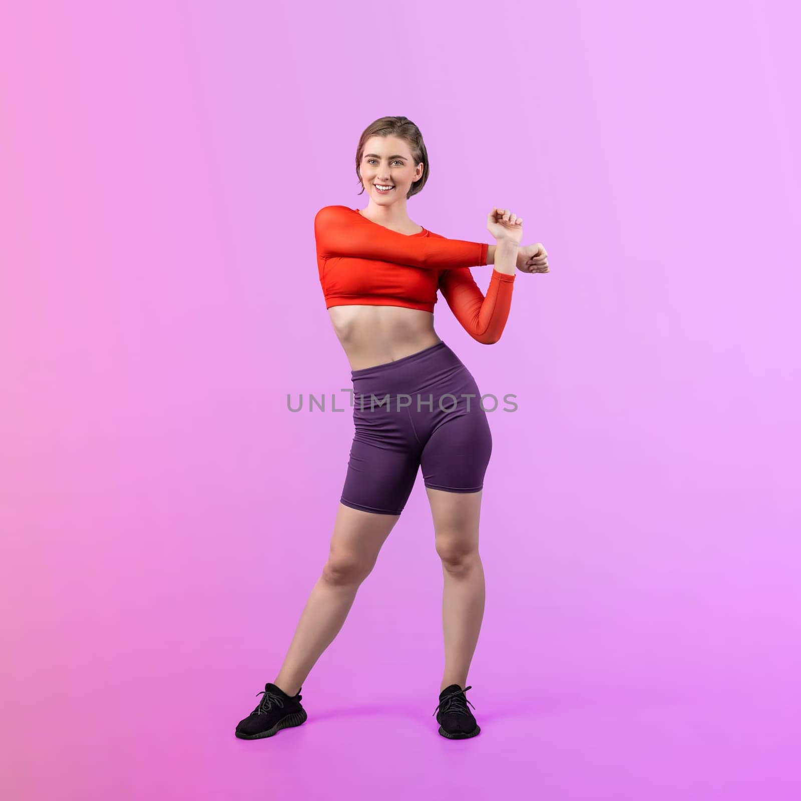 Full body length gaiety shot athletic and sporty young woman with fitness warmup and stretching body for pre exercise posture on isolated background. Healthy active and body care lifestyle.