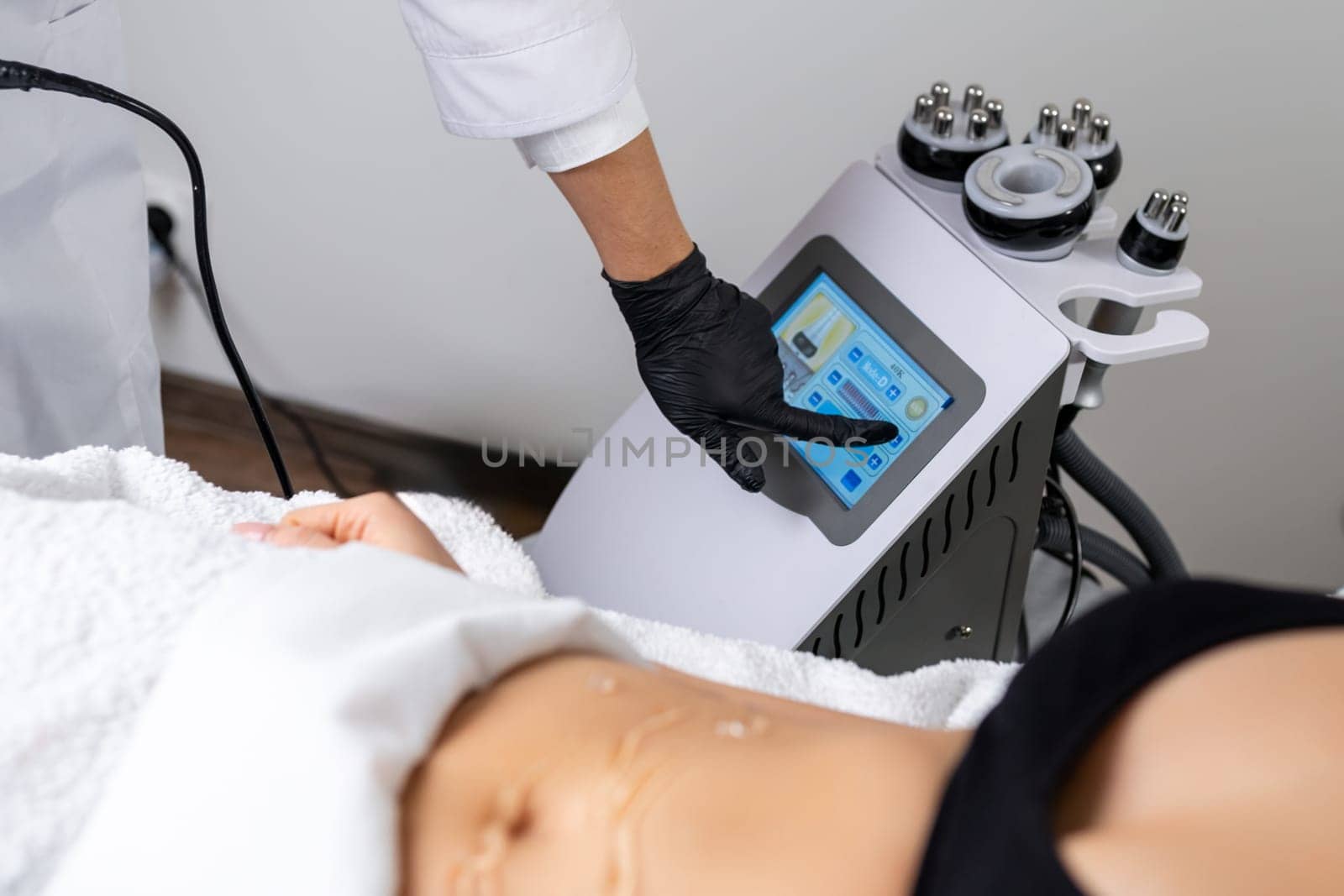 Woman calibrates vacuum cavitation device for effective results by vladimka