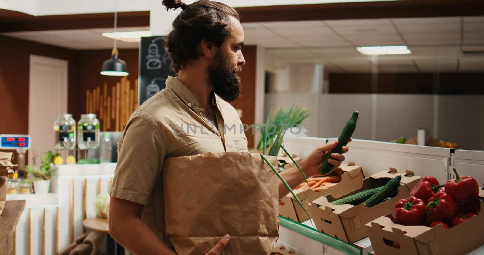 Man testing bio shop veggies are organic by DCStudio