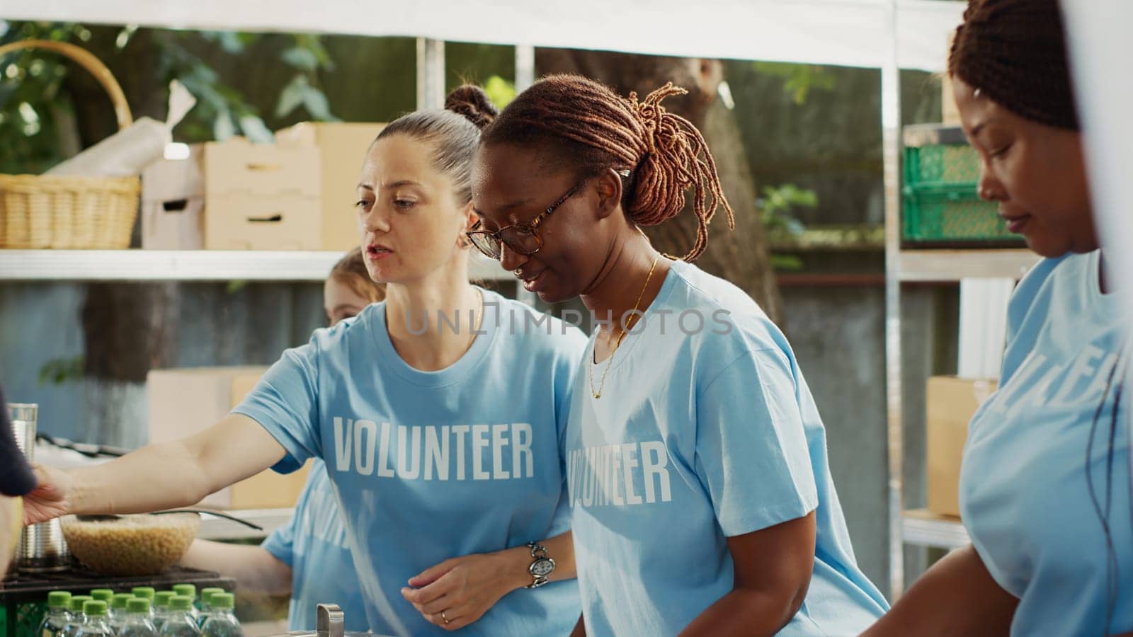 Multiracial team that fights hunger distributes free meals to the poor while helping and supporting the homeless. Warm meals are provided by volunteers in effort to combat hunger and poverty.