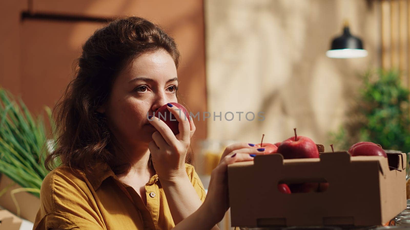 Woman enjoys blissful bio apples smell by DCStudio