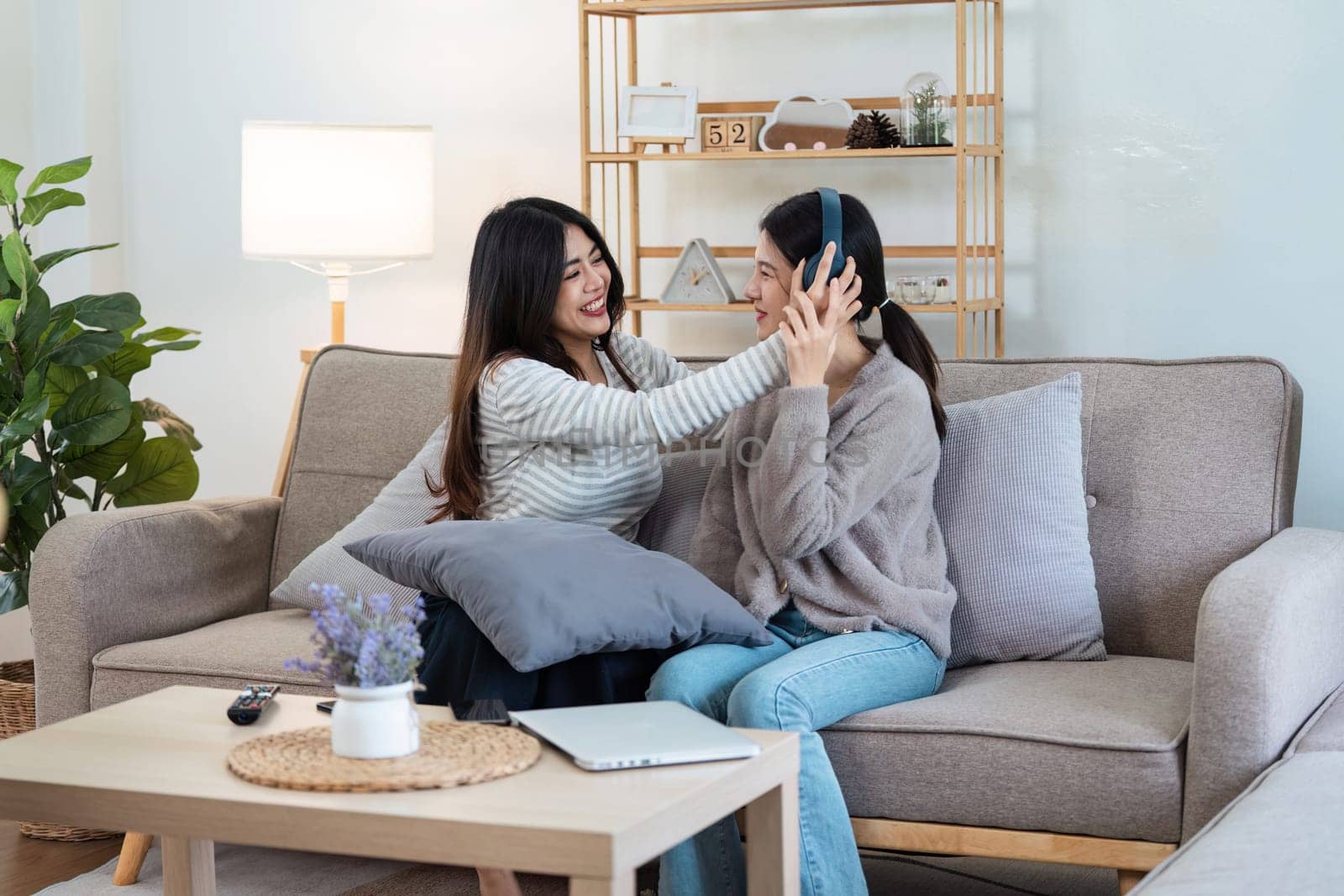 pride month. Happy woman lesbian gay lgbt couple celebrating love together during relax at home. lgbtq couple concept.