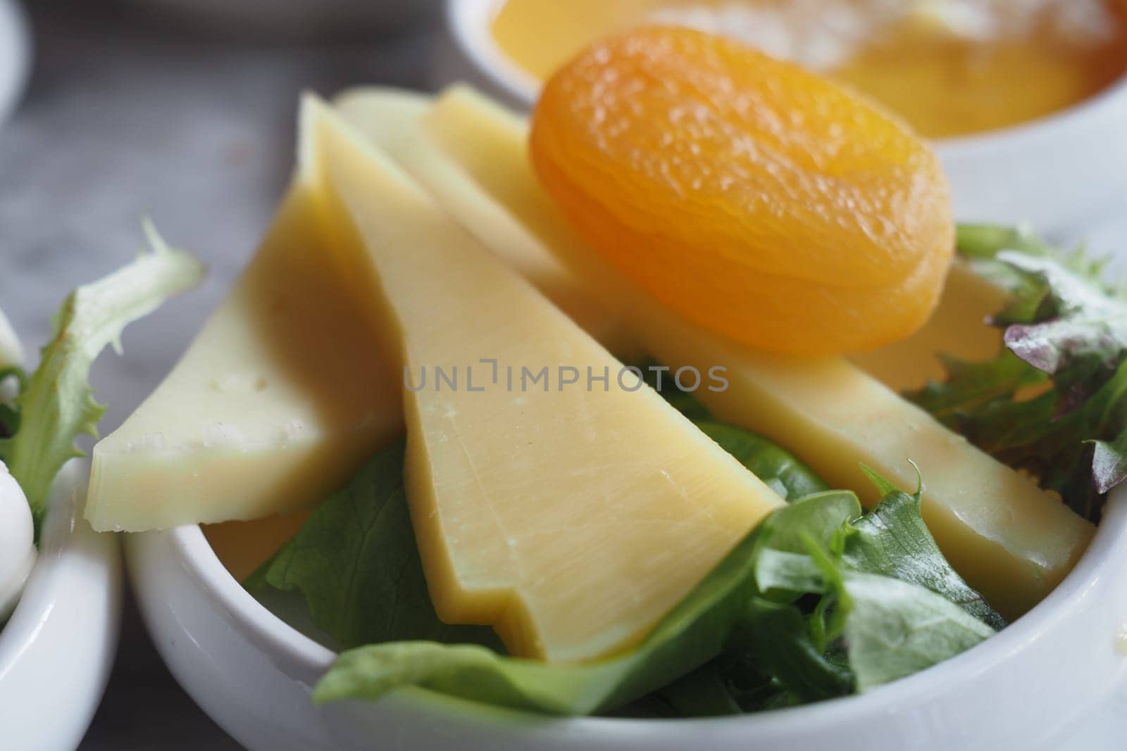 Cheese platter with dry food on a plate ,