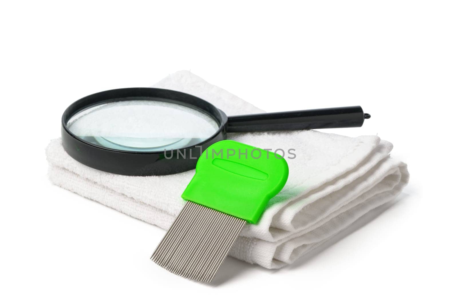 Anti lice combs and towel on white background close up