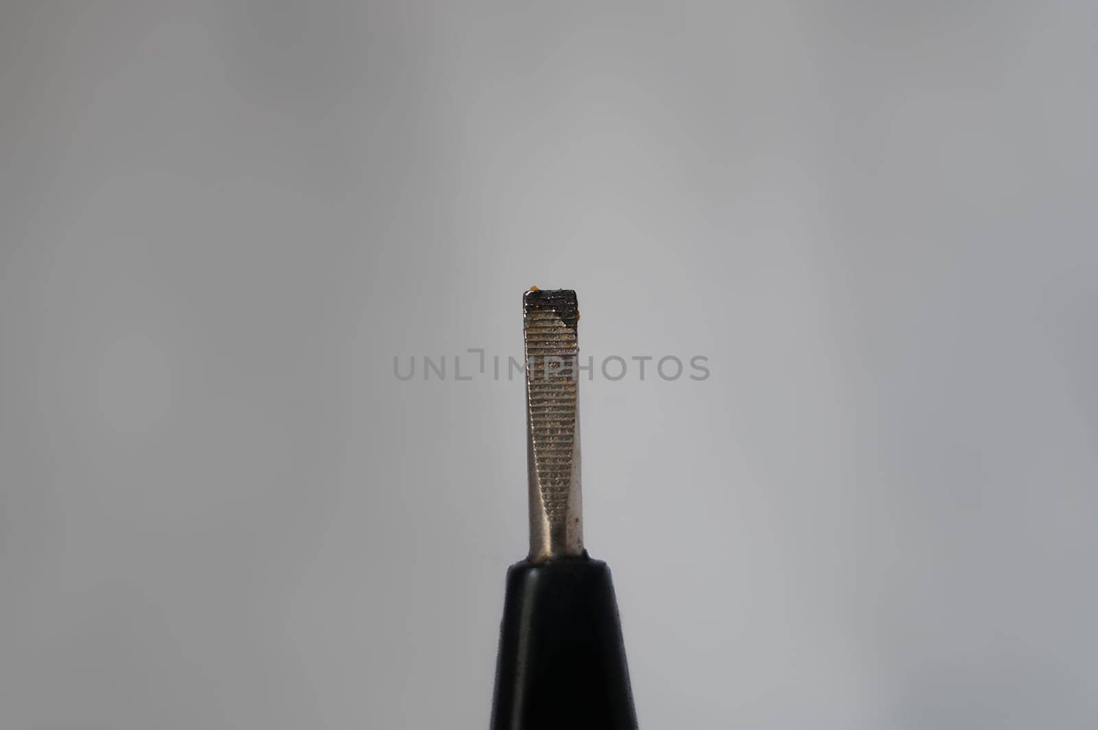 Close-Up of a Black-Handled Screwdriver. High quality photo