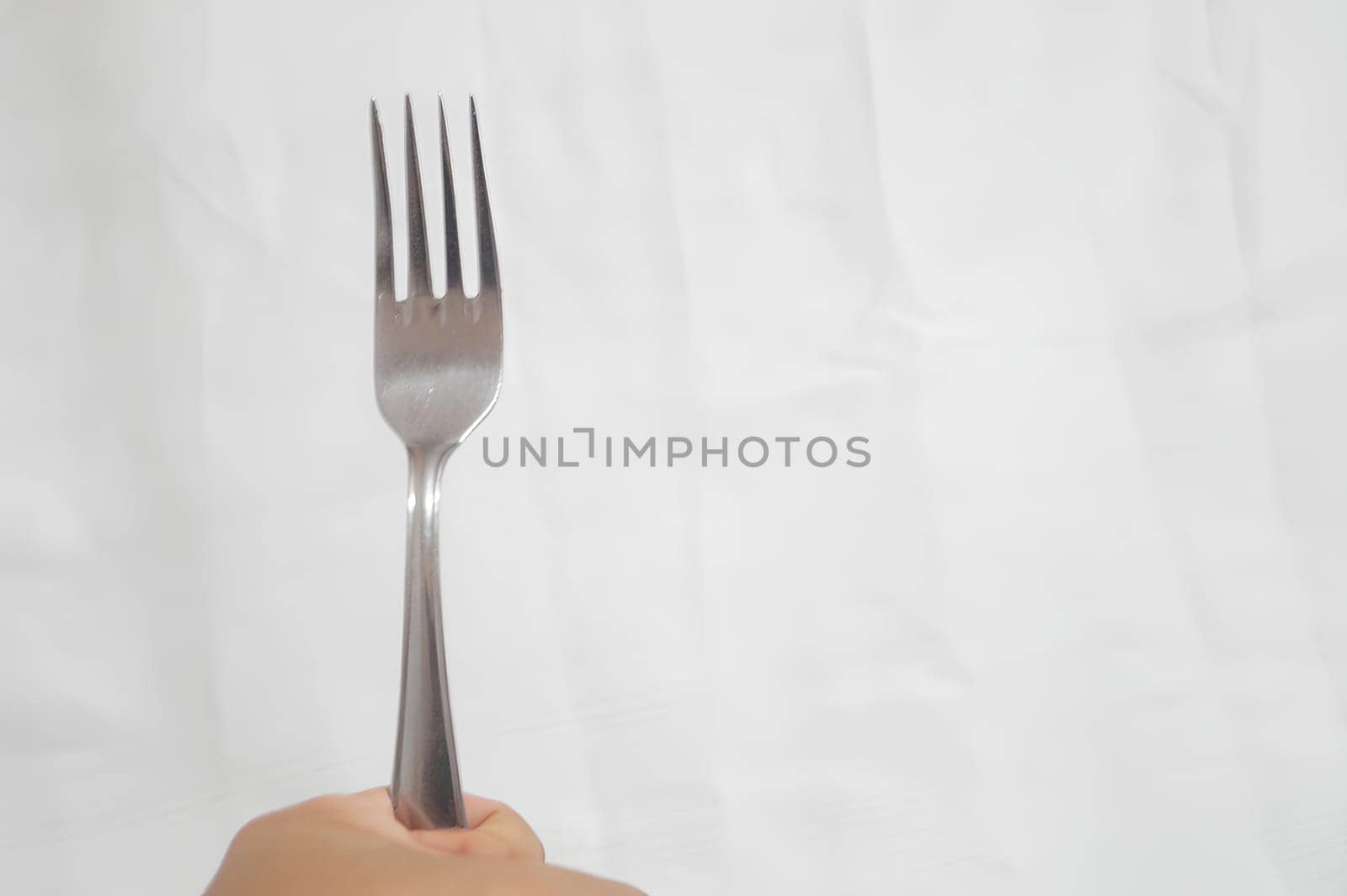 A fork is shown in a white background. High quality photo