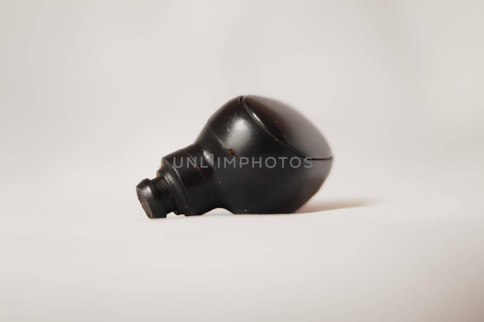 Black Wireless Earbud On White Background. High quality photo