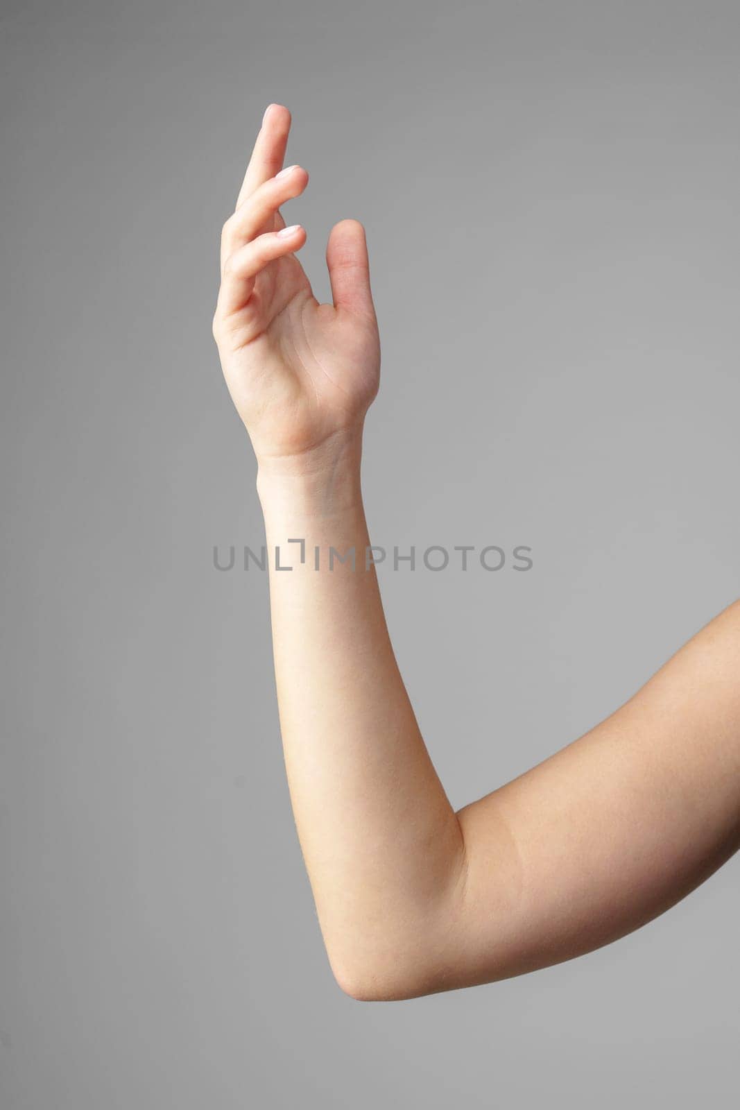 Woman Holding Arm Up in the Air with Gesture close up