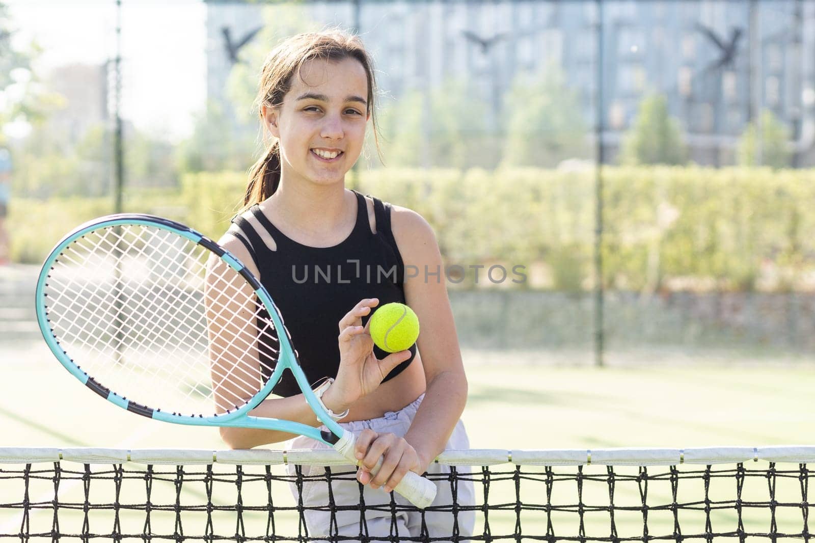 teenage tennis player woman on court with racket. High quality photo