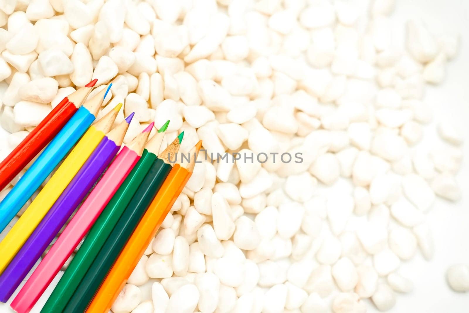 Draw,paint. Colored pencils on white stones, inspired by jovani68