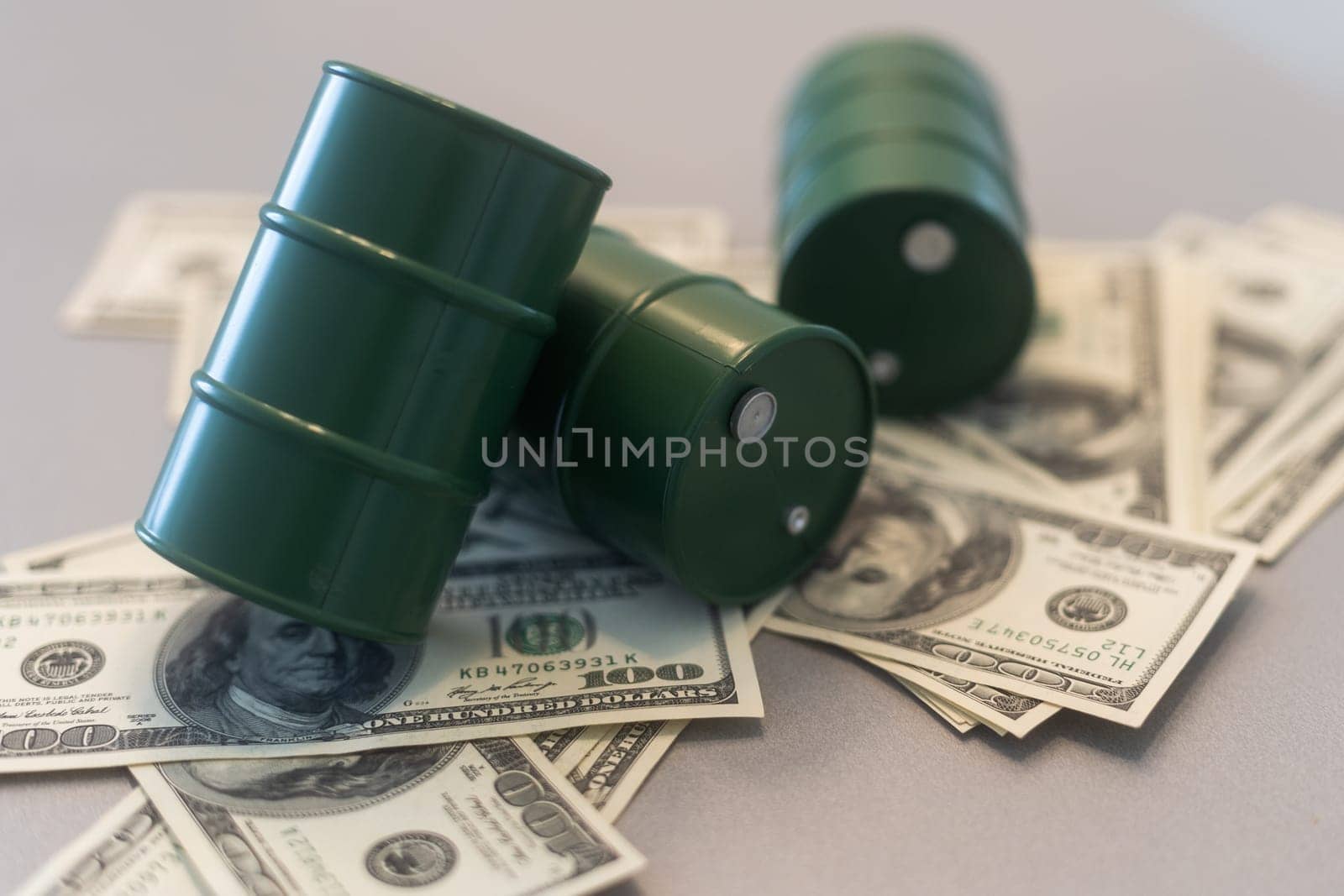 a barrel and dollar bills on a white background. High quality photo