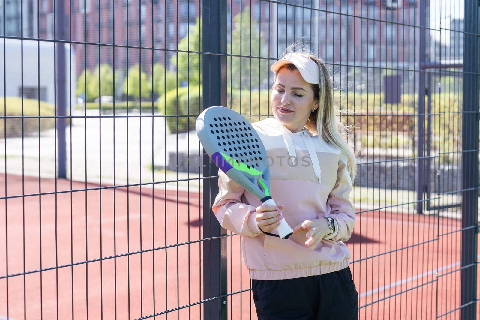 One women playing Paddle tennis. High quality photo