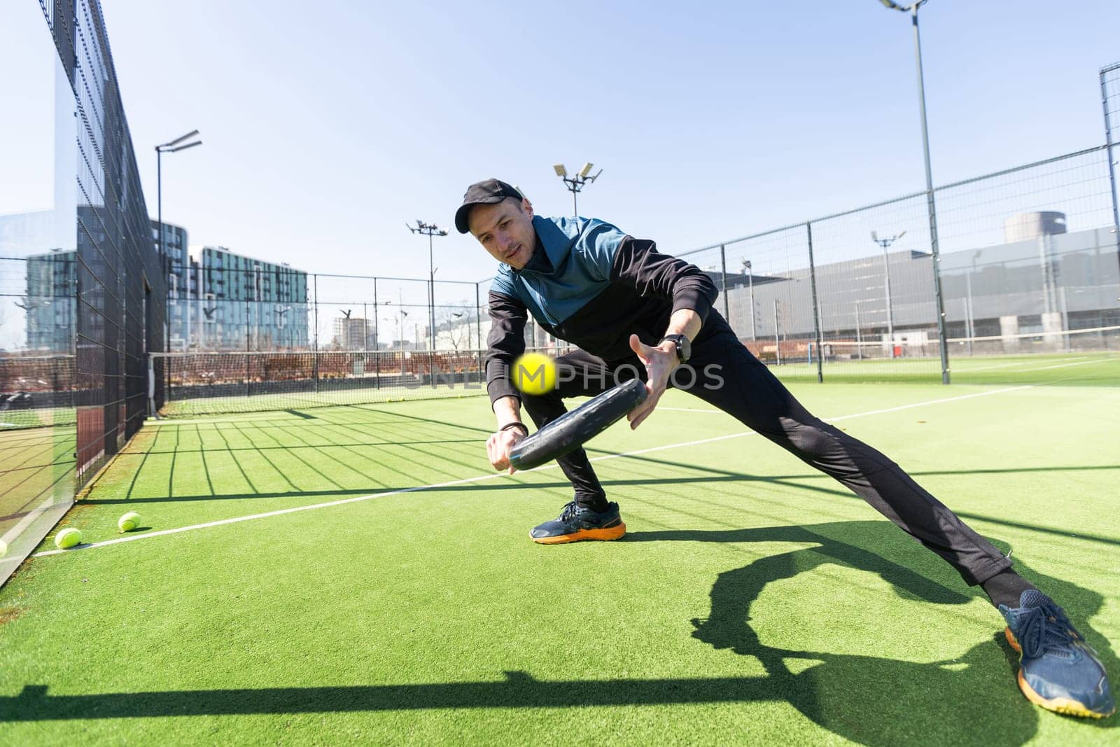 man playing paddle tennis at indoors pitch. High quality photo