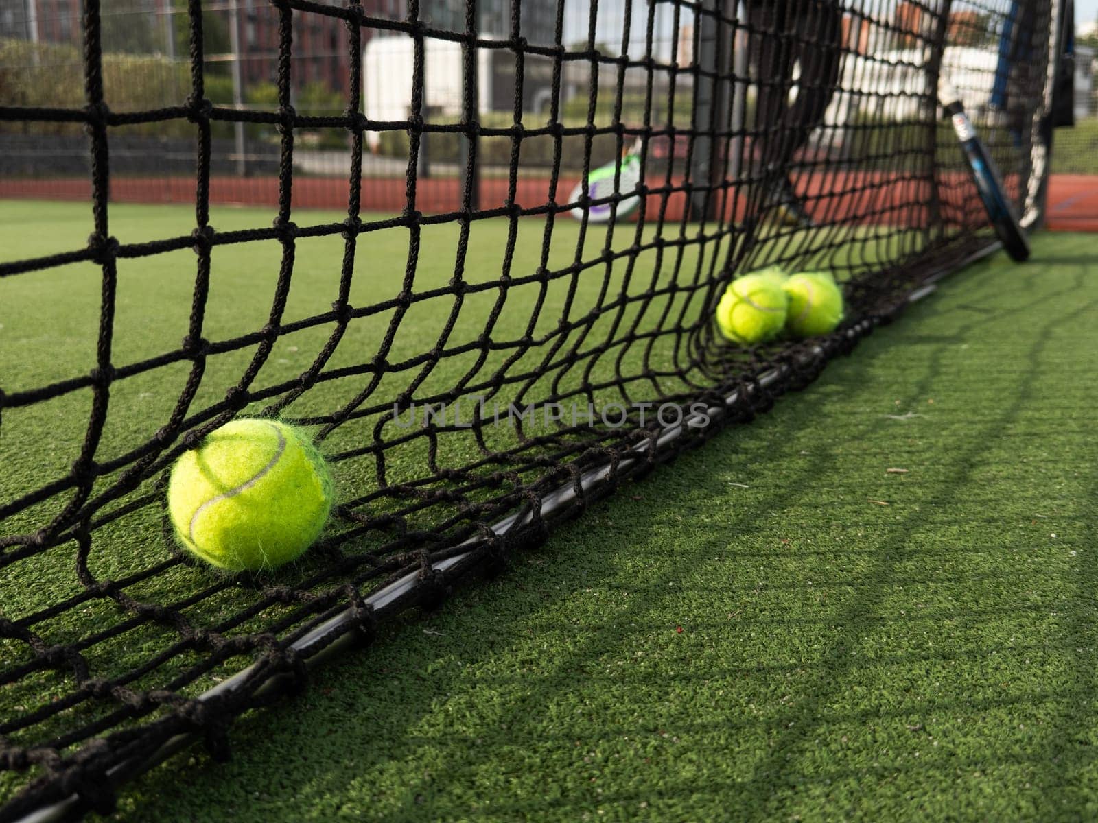 Tennis balls are on green grass. High quality photo