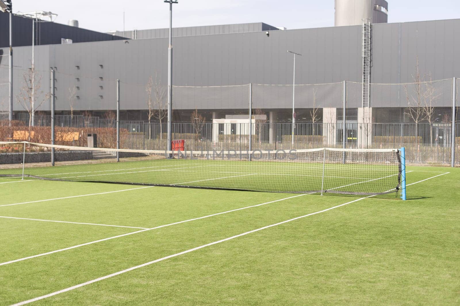 Tennis net on a green field. High quality photo