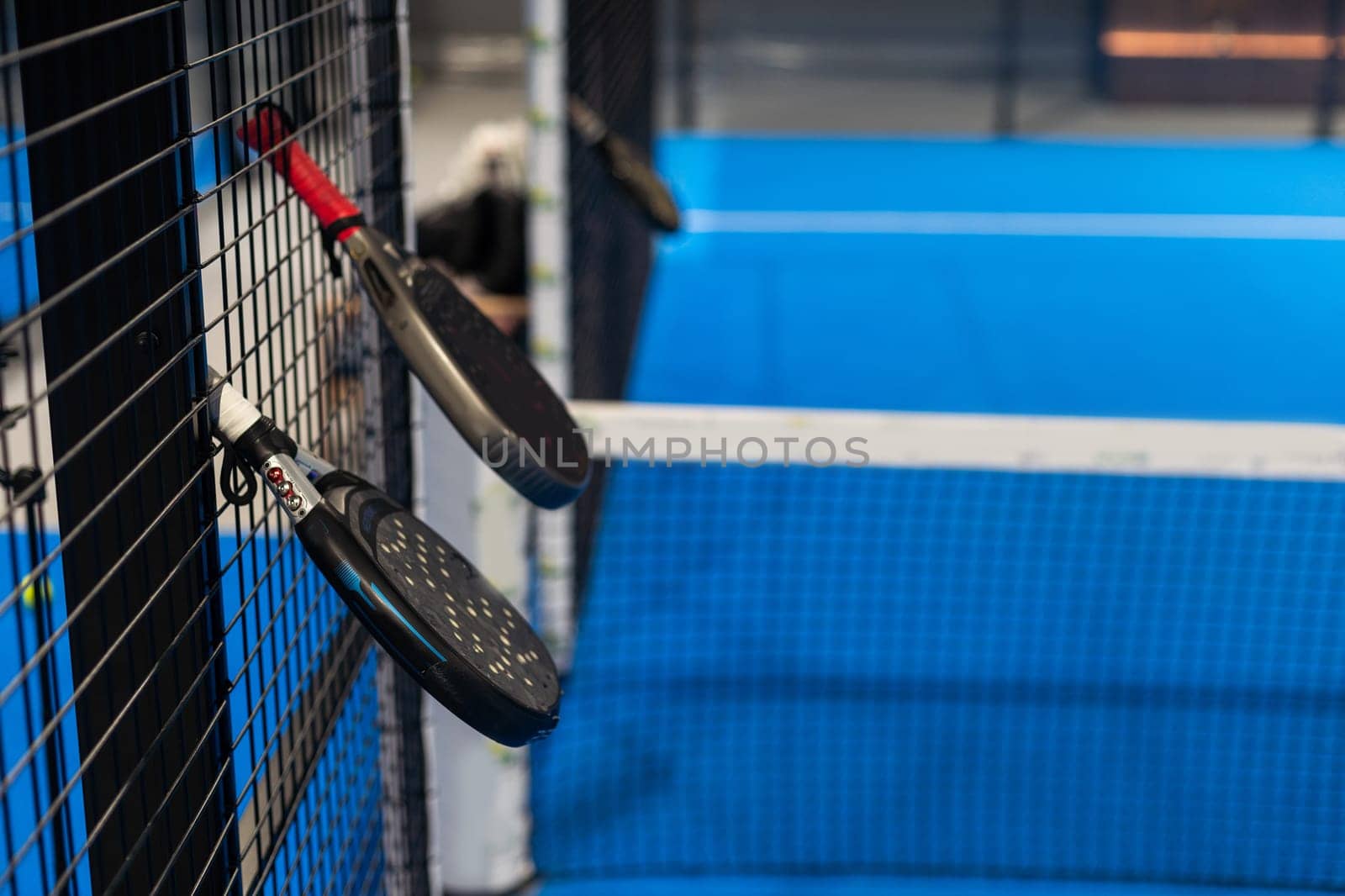 Paddle objects on blue court. High quality photo