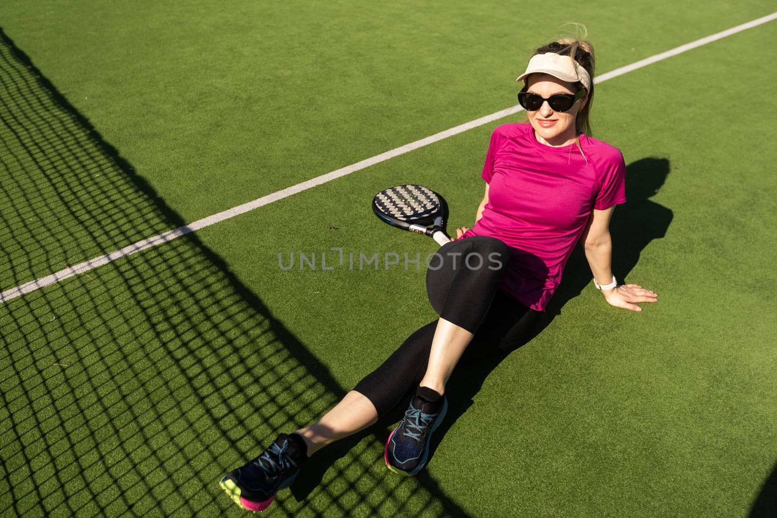 One women playing Paddle tennis. High quality photo