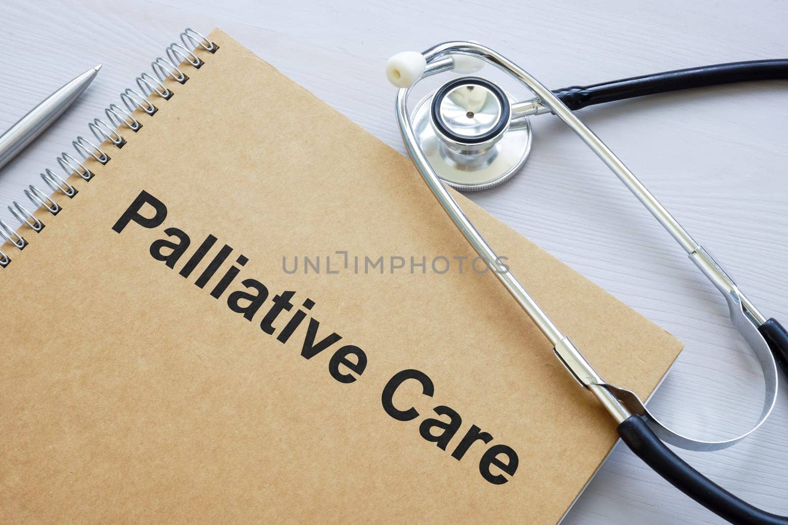 A book about palliative care and medical stethoscope.