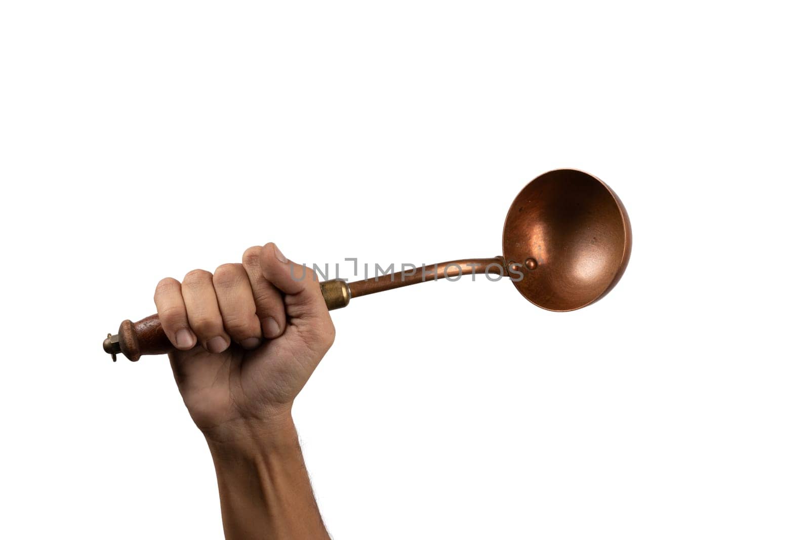 Black male hand holding a brass vintage kitchen ladle on white background by TropicalNinjaStudio