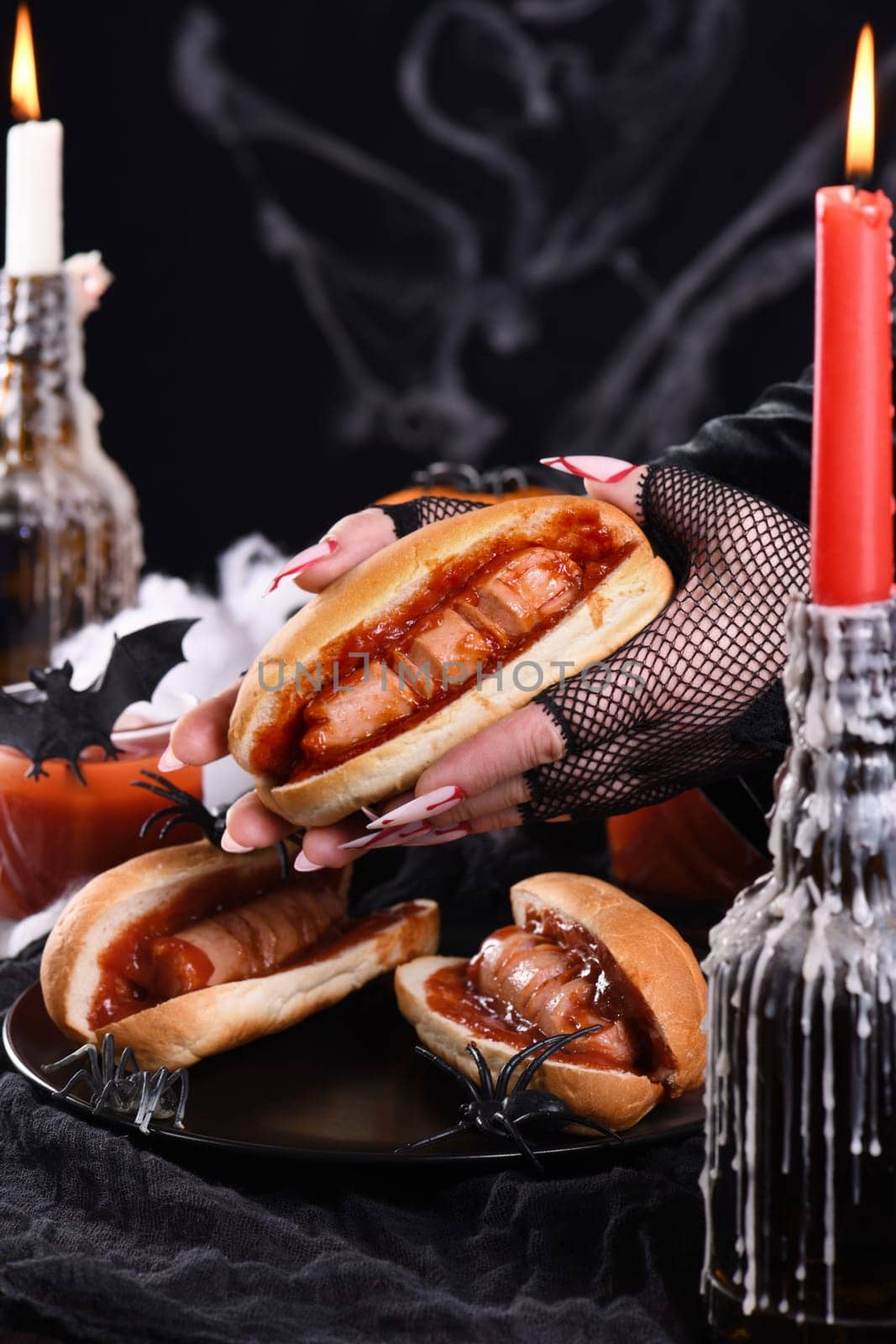  Hot dog Bloody fingers in the hands of a witch. Halloween appetizer