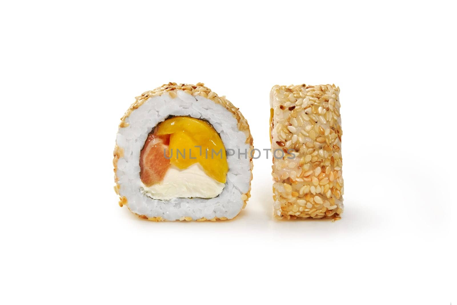Exotic sweet and savory sushi roll filled with salmon, delicate cream cheese and ripe mango slices, generously sprinkled with sesame seeds presented on white background. Japanese style cuisine