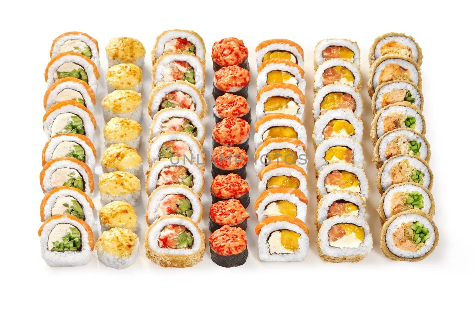 Enticing colorful collection of rolls with various fillings, presented isolated on white background. Tasty set of traditional Japanese sushi for company