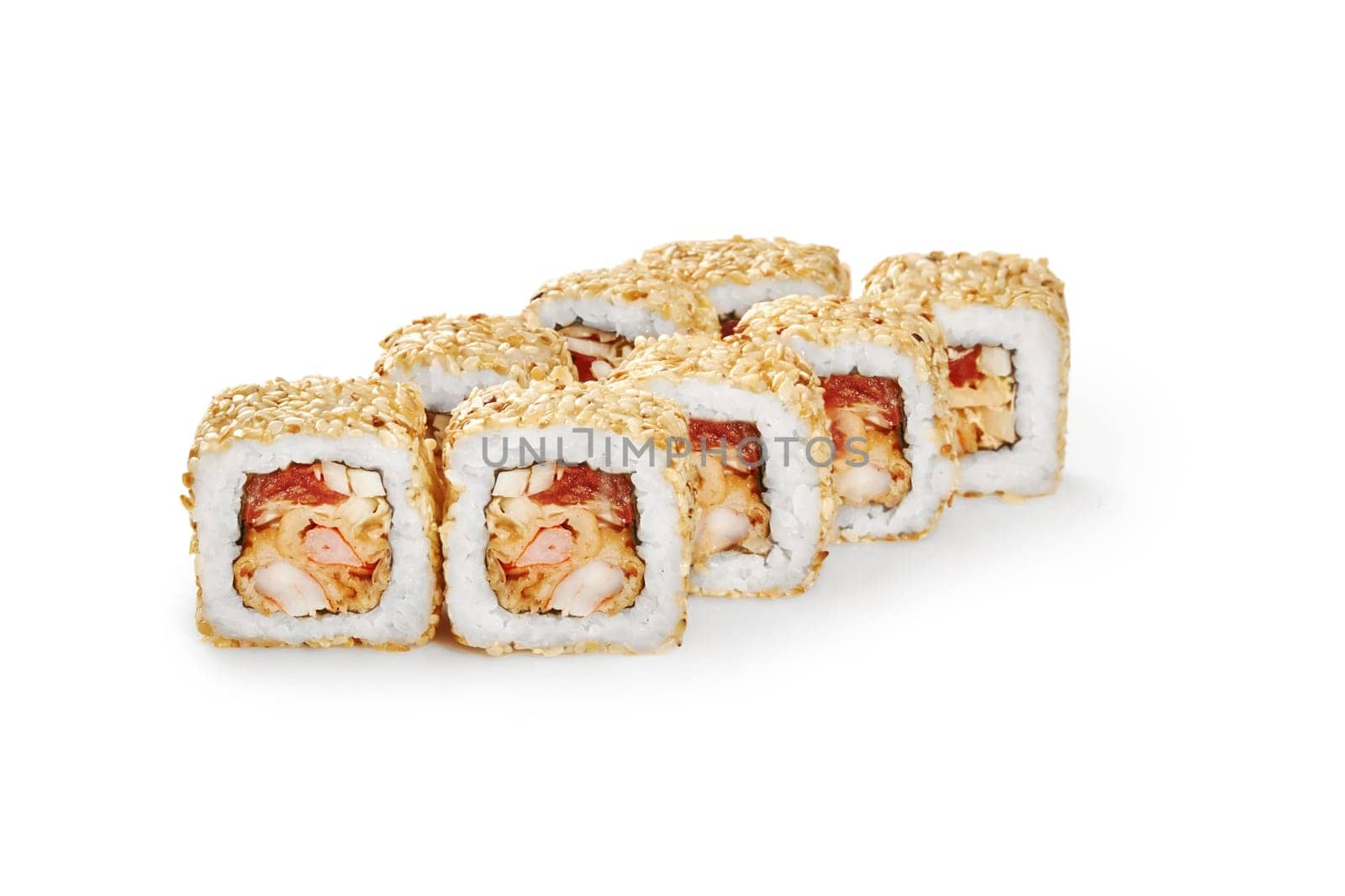 Delicious rolls coated with toasted sesame seeds, filled with tempura shrimp, tobiko and apple, isolated on white background. Fusion version of traditional Japanese sushi