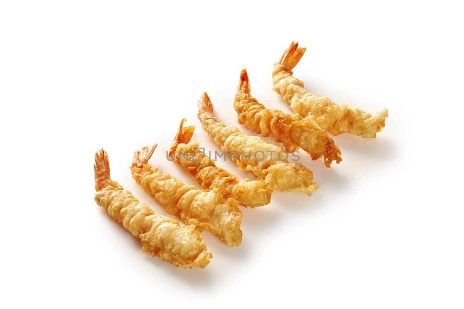 Lightly battered and fried crispy tempura shrimps displayed neatly isolated against white backdrop, embodying classic Japanese dish