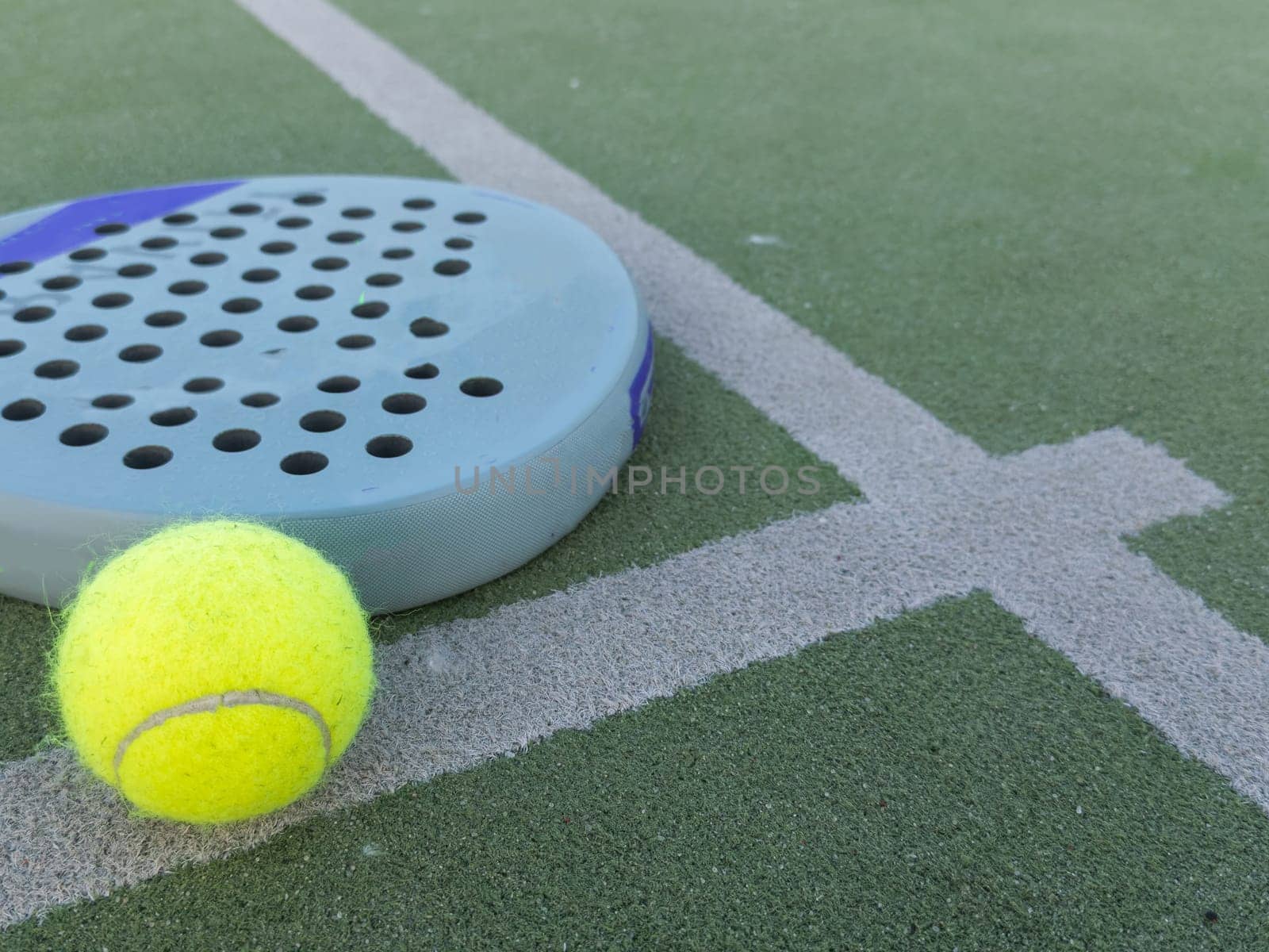 Paddle tennis racket and ball. High quality photo