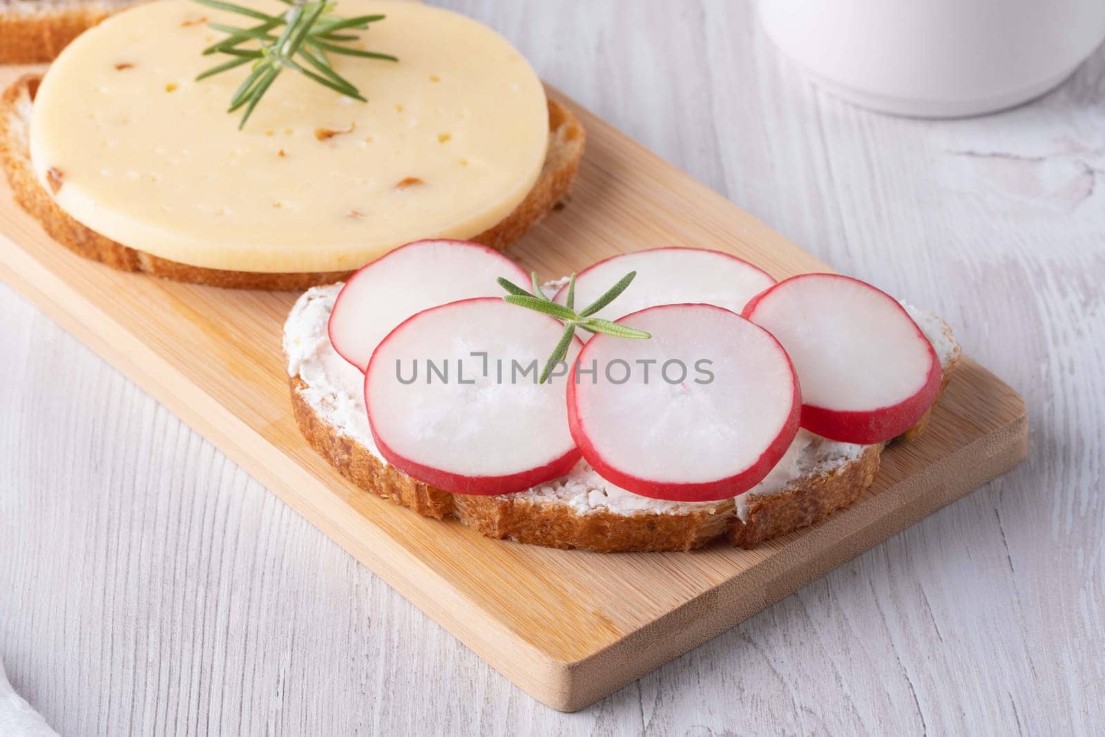 Sandwiches with radishes, cottage cheese and cheese.