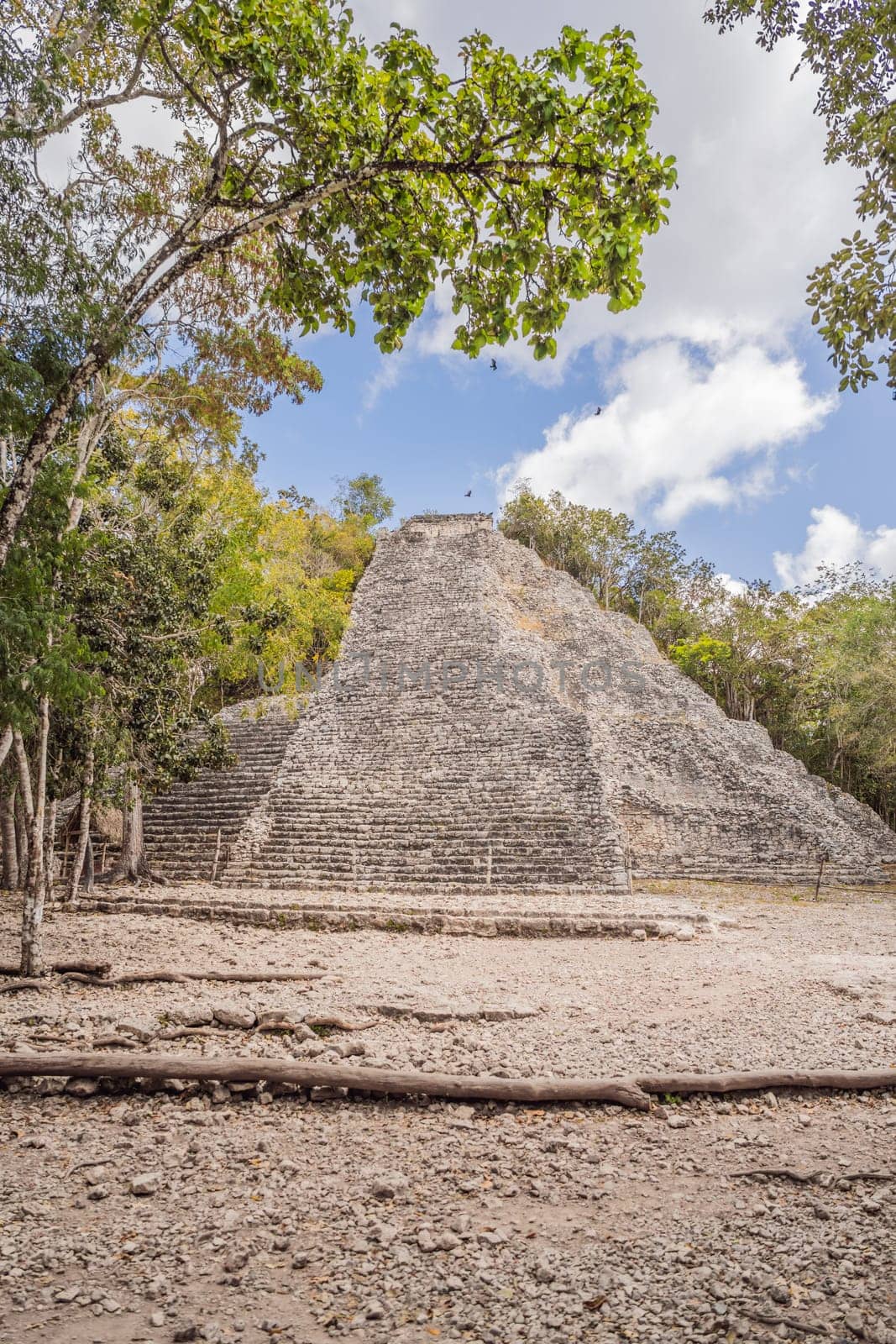 Coba, Mexico. Ancient mayan city in Mexico. Coba is an archaeological area and a famous landmark of Yucatan Peninsula. Cloudy sky over a pyramid in Mexico.